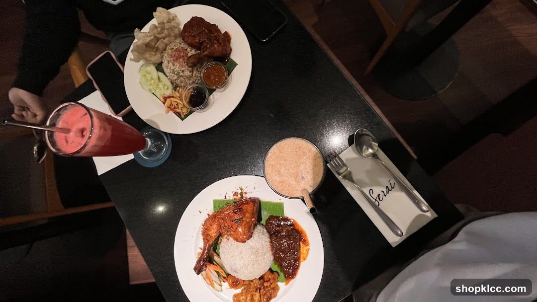 Two plates of food and drinks on a table