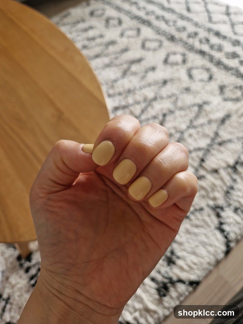 Hand with Yellow Nail Polish