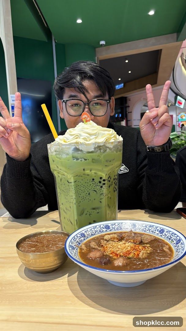 Man with Large Matcha Drink and Food