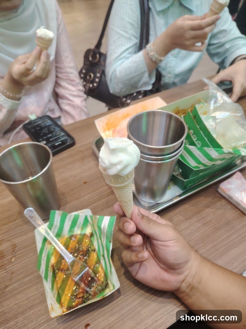 People enjoying ice cream cones and food