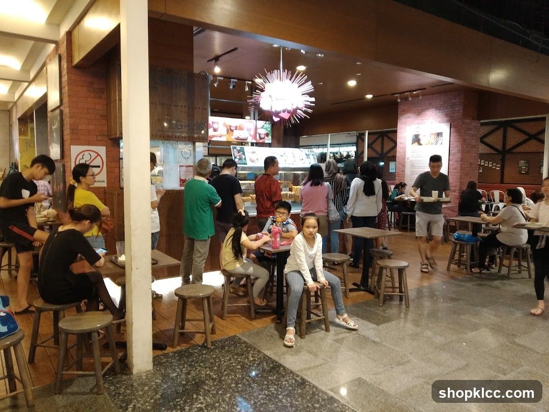 People dining and queuing in a cafe