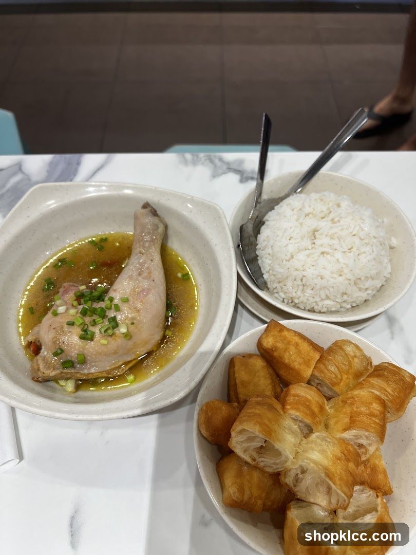 Chicken dish with rice and fried dough sticks