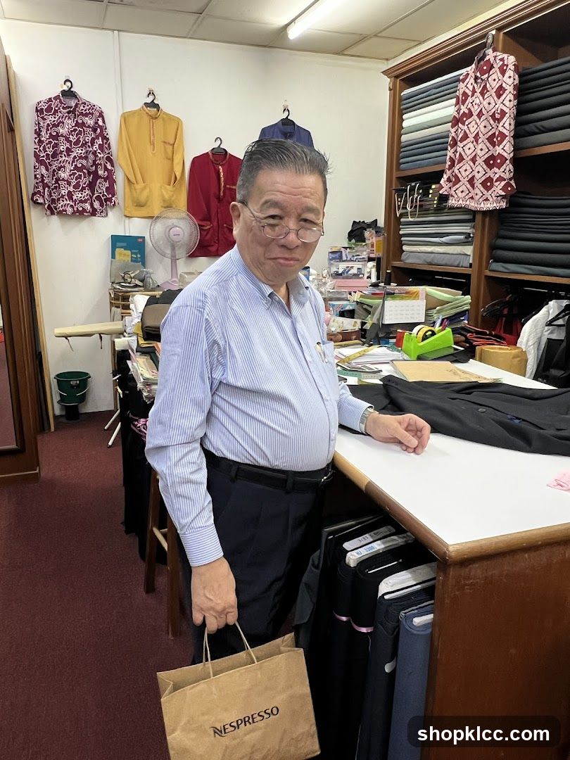 Tailor's shop with man holding shopping bag