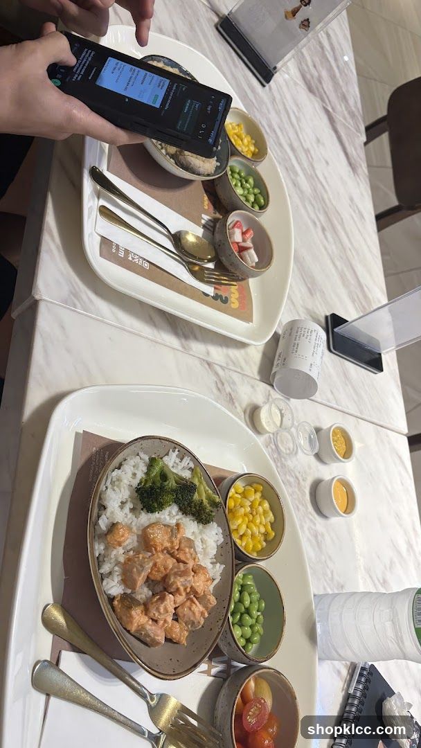 Two meals with sides and sauces