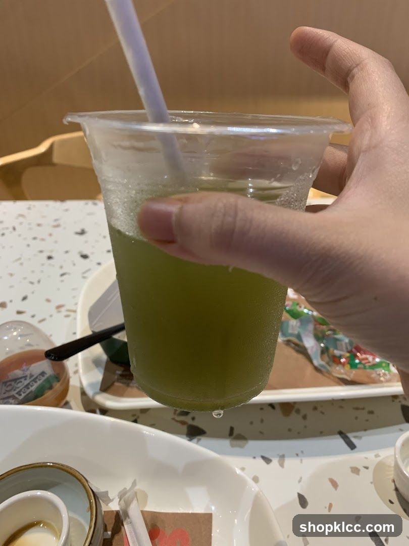 Green Drink in Plastic Cup