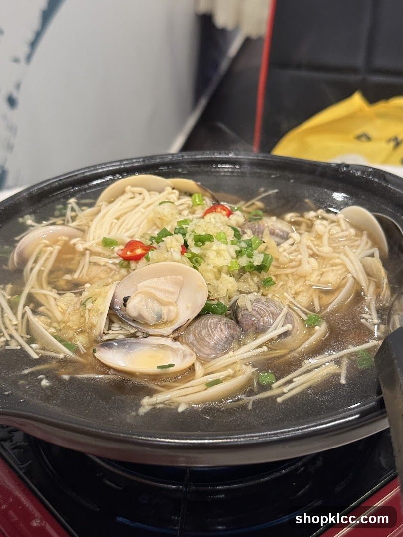 Steaming Pot of Clams and Enoki Mushrooms