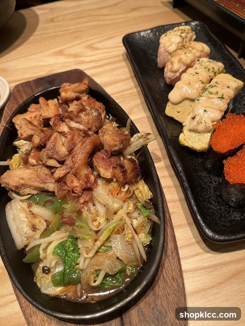 Sizzling Chicken and Vegetable Dish with Sushi