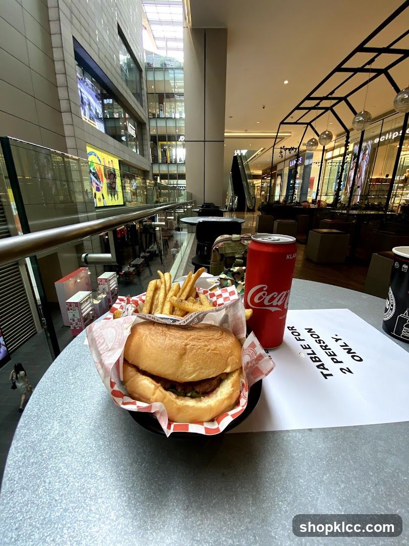 Burger, Fries, and Coca-Cola at a Table