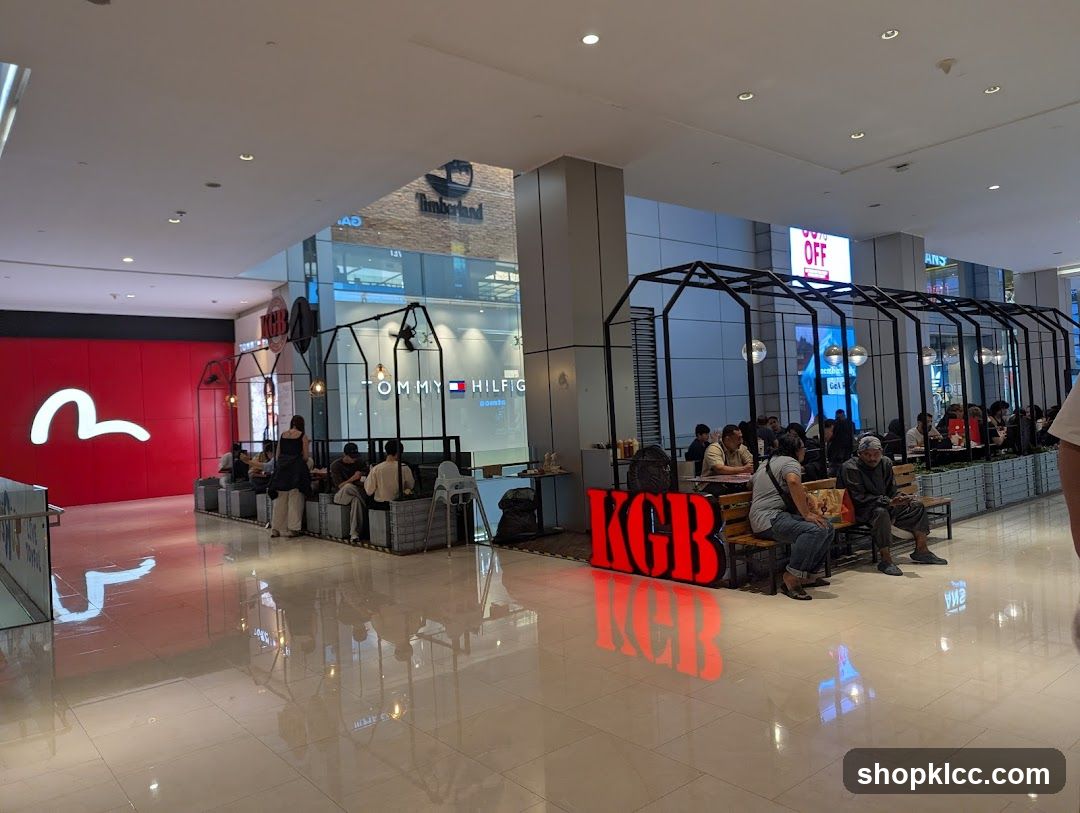 Indoor mall seating area with shops
