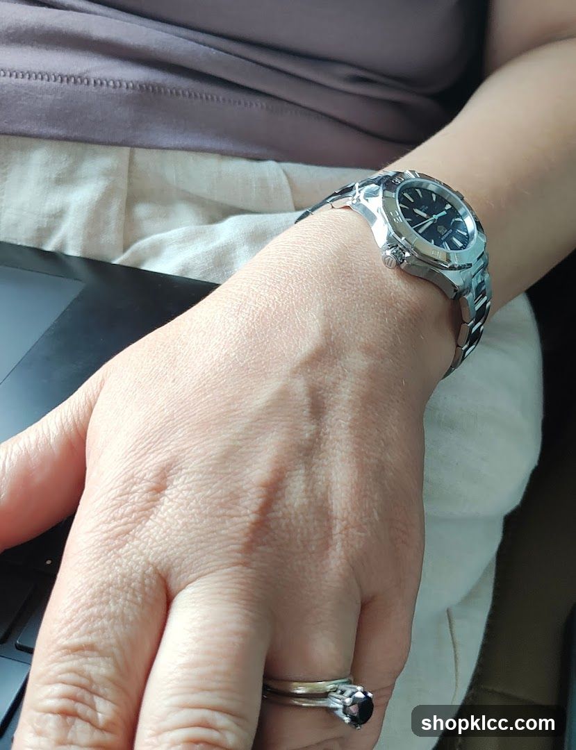 Woman wearing a watch and ring