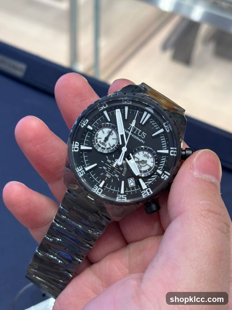 Hand holding watch