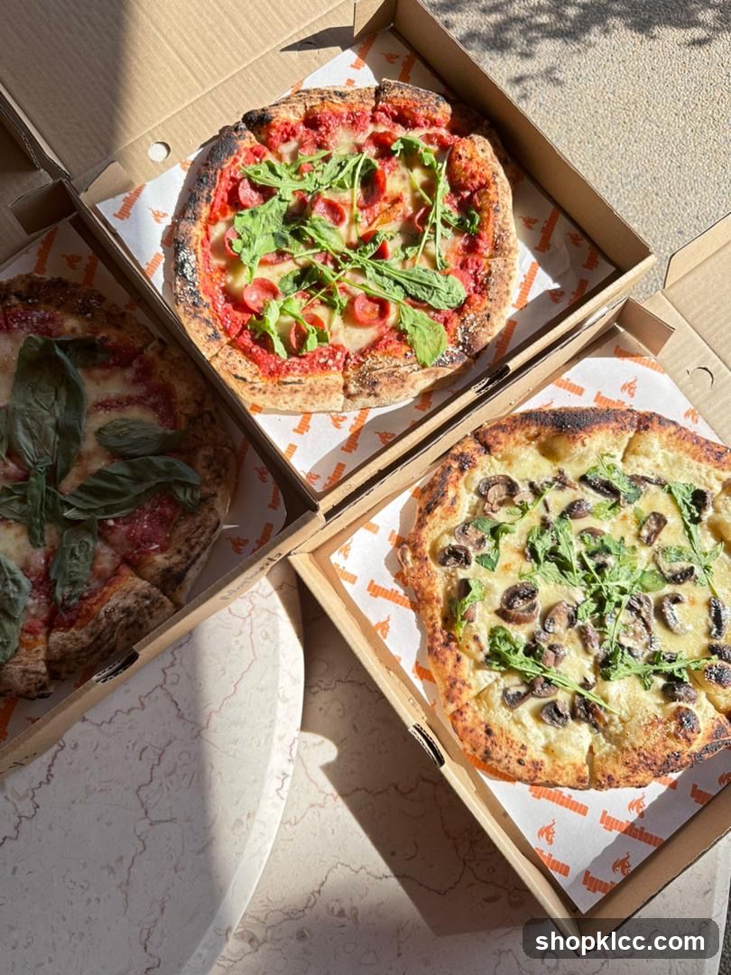 Three Pizzas in Boxes