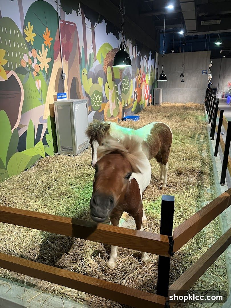 Pony enclosure with cartoon mural