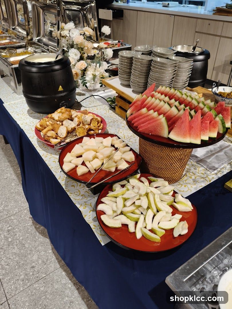 Buffet Spread with Fruits and Pastries
