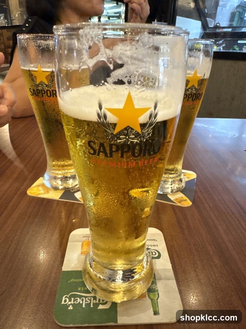 Three glasses of Sapporo beer