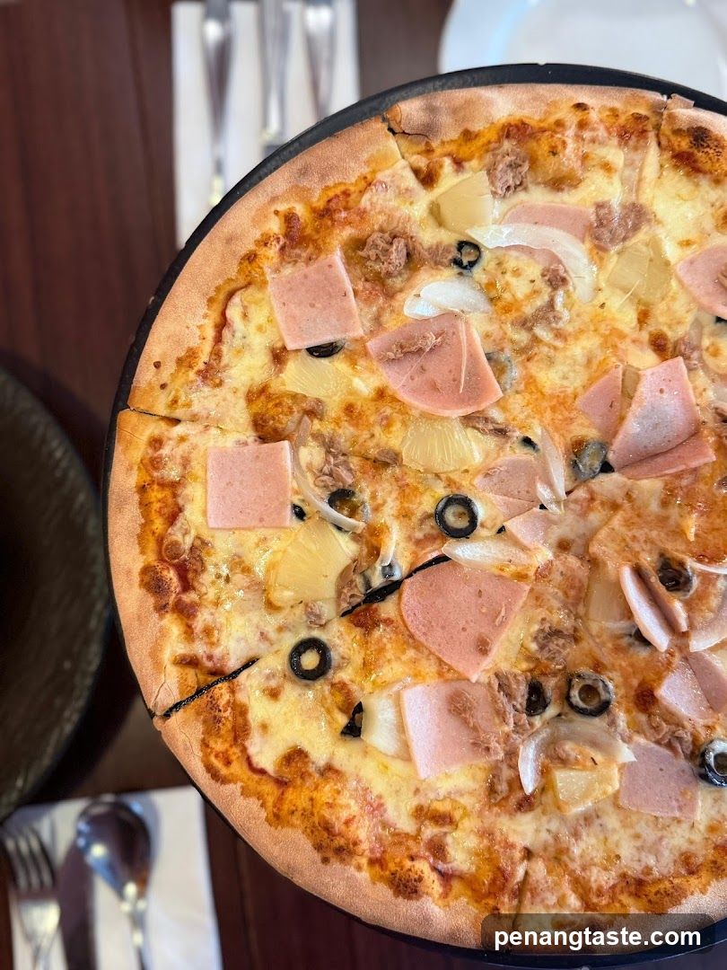 Pizza with Ham, Pineapple, and Olives