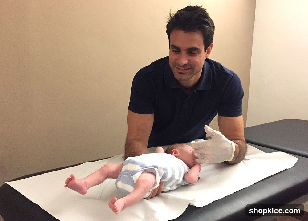 Doctor examining a baby