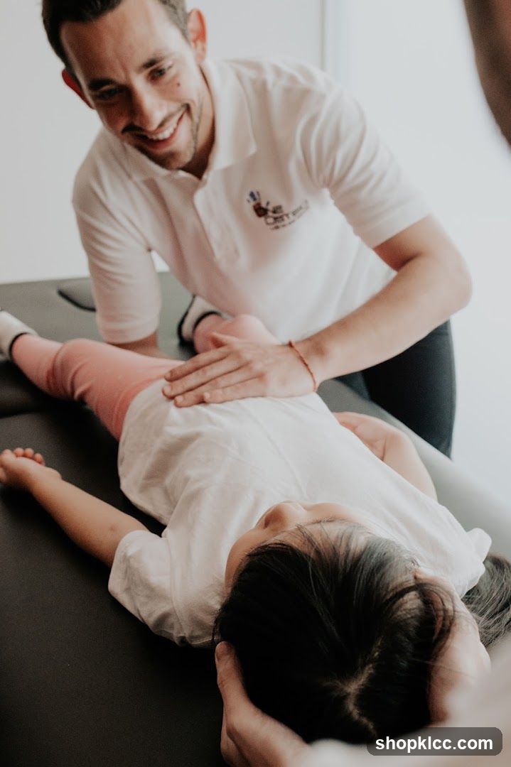 Chiropractor examining a child