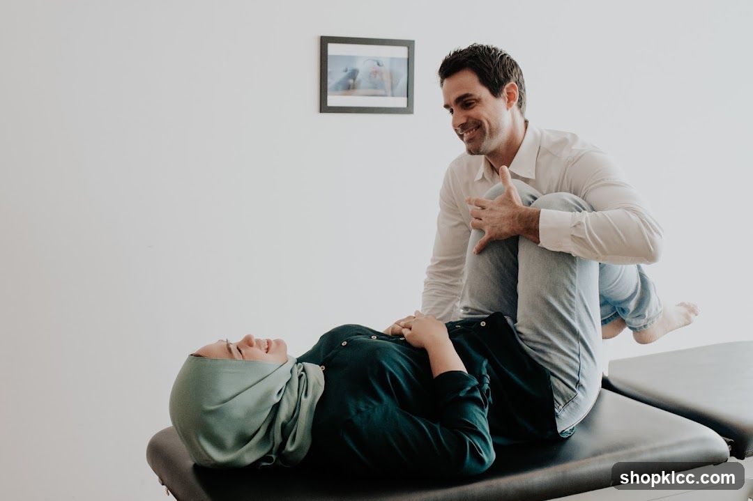 Therapist assisting patient