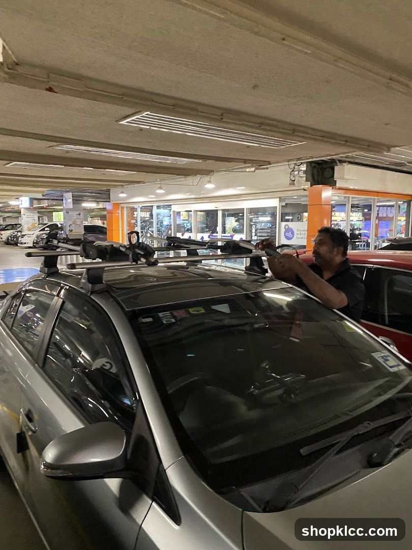 Car with roof rack in parking garage