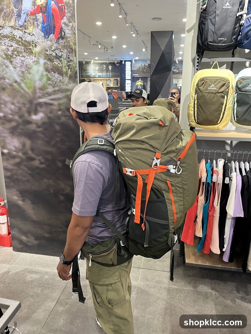 Man trying on a large backpack