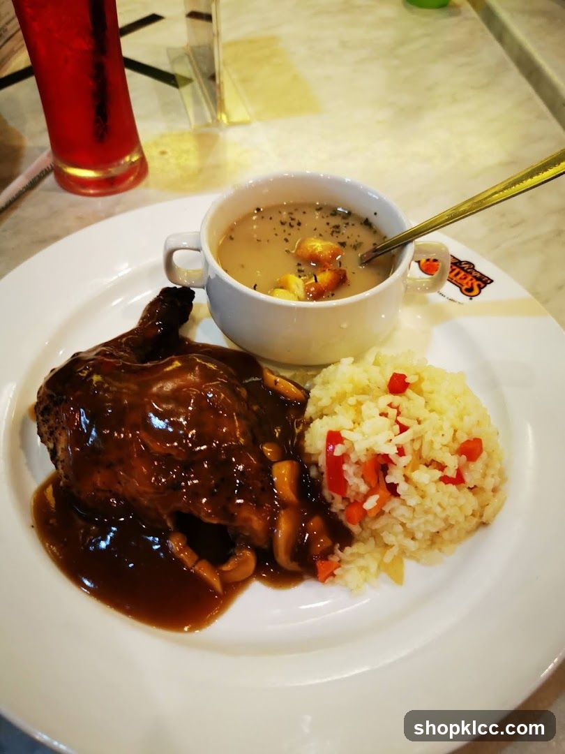 Chicken dish with rice and soup