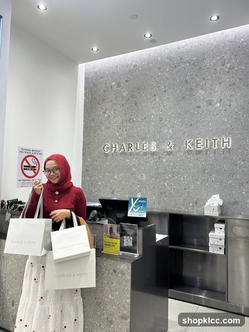 Woman with Shopping Bags at Charles & Keith Store