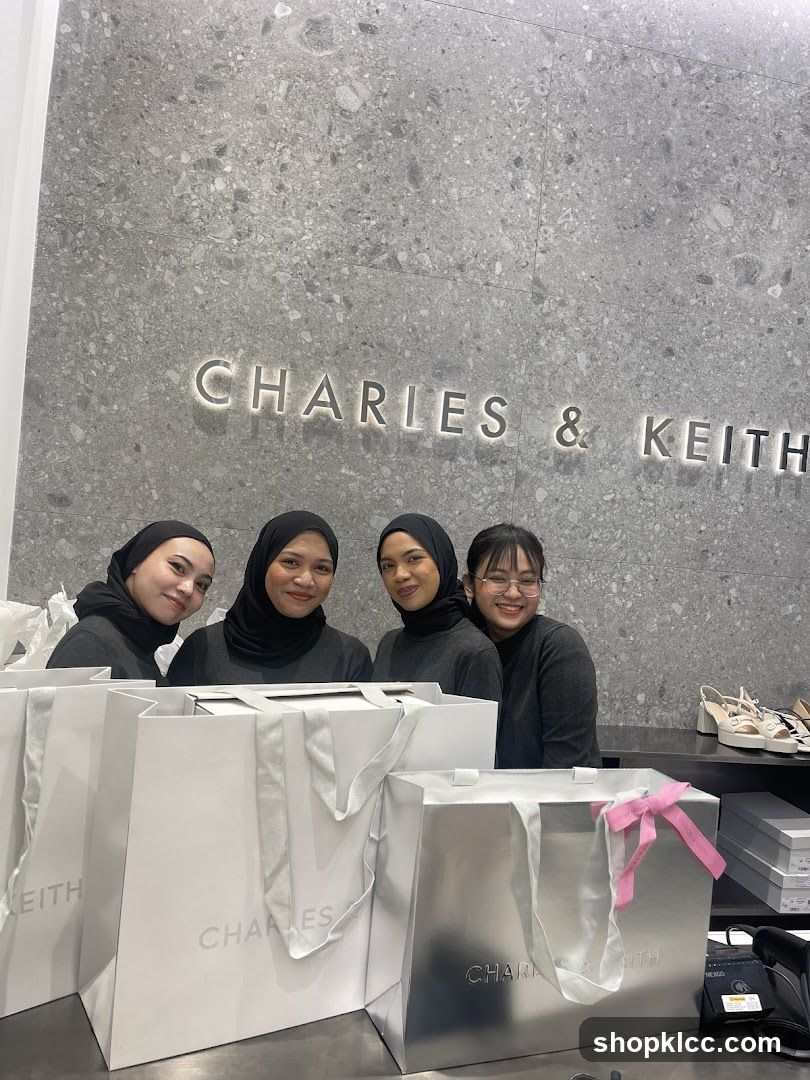 Staff Posing with Shopping Bags