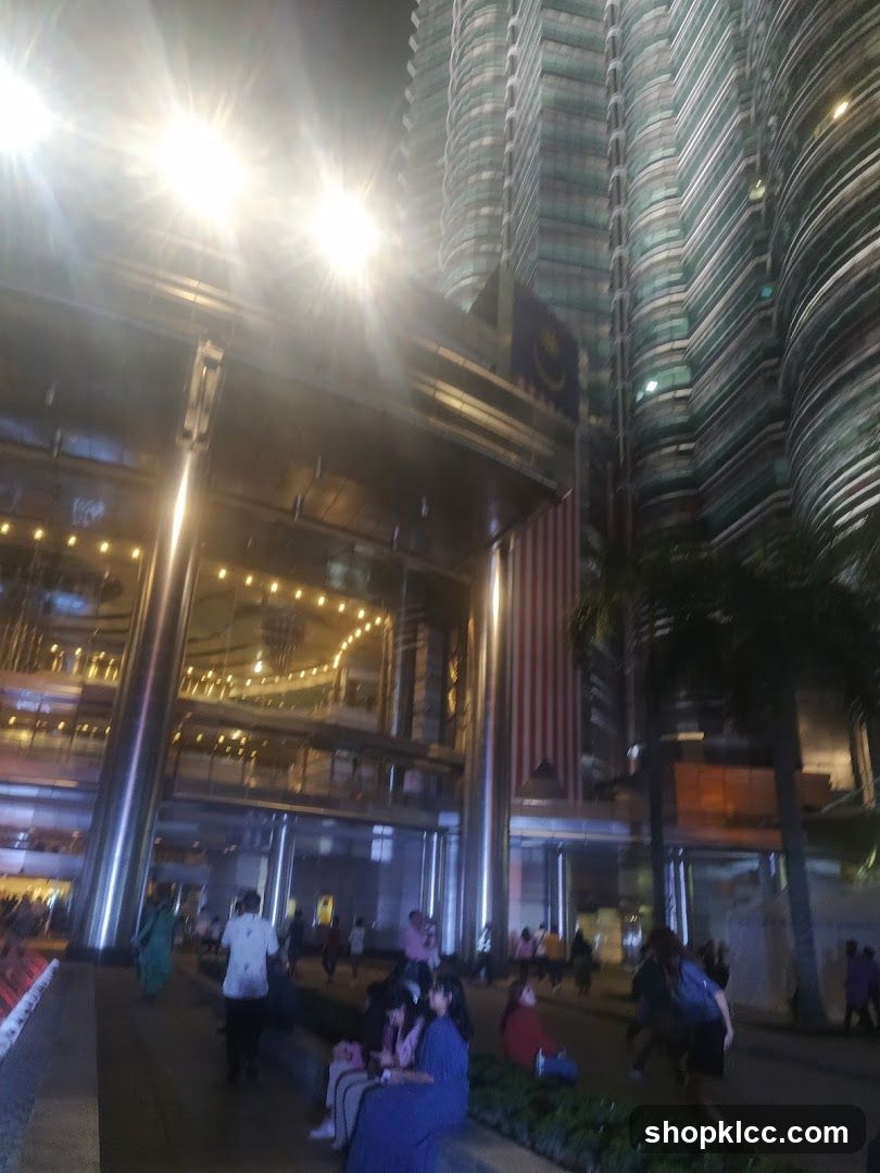 Nighttime view of a modern building with people
