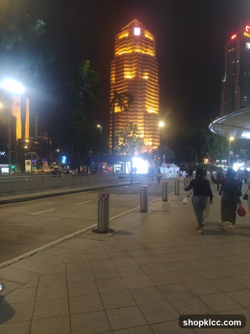 Cityscape at Night with Illuminated Skyscraper