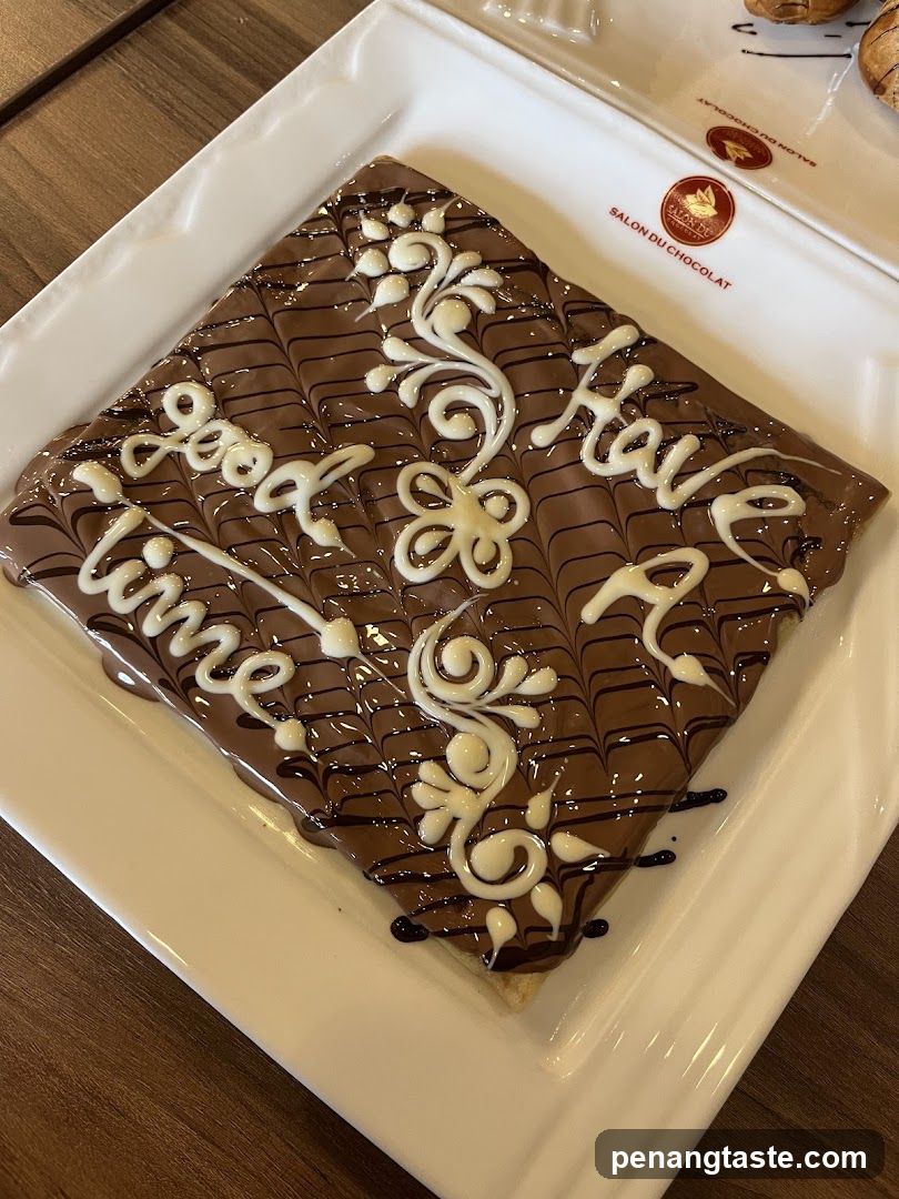 Chocolate Crepe with White Icing Decoration