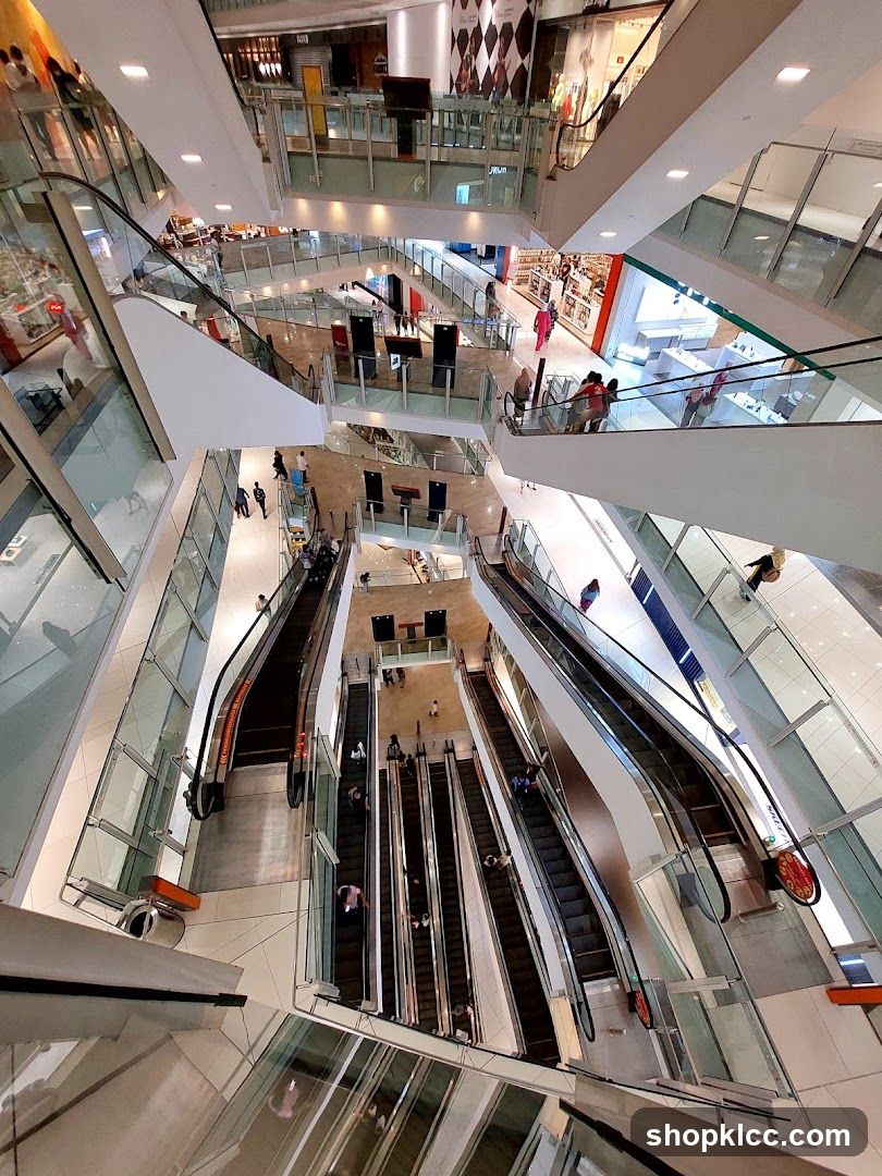 Multi-level shopping mall interior with escalators