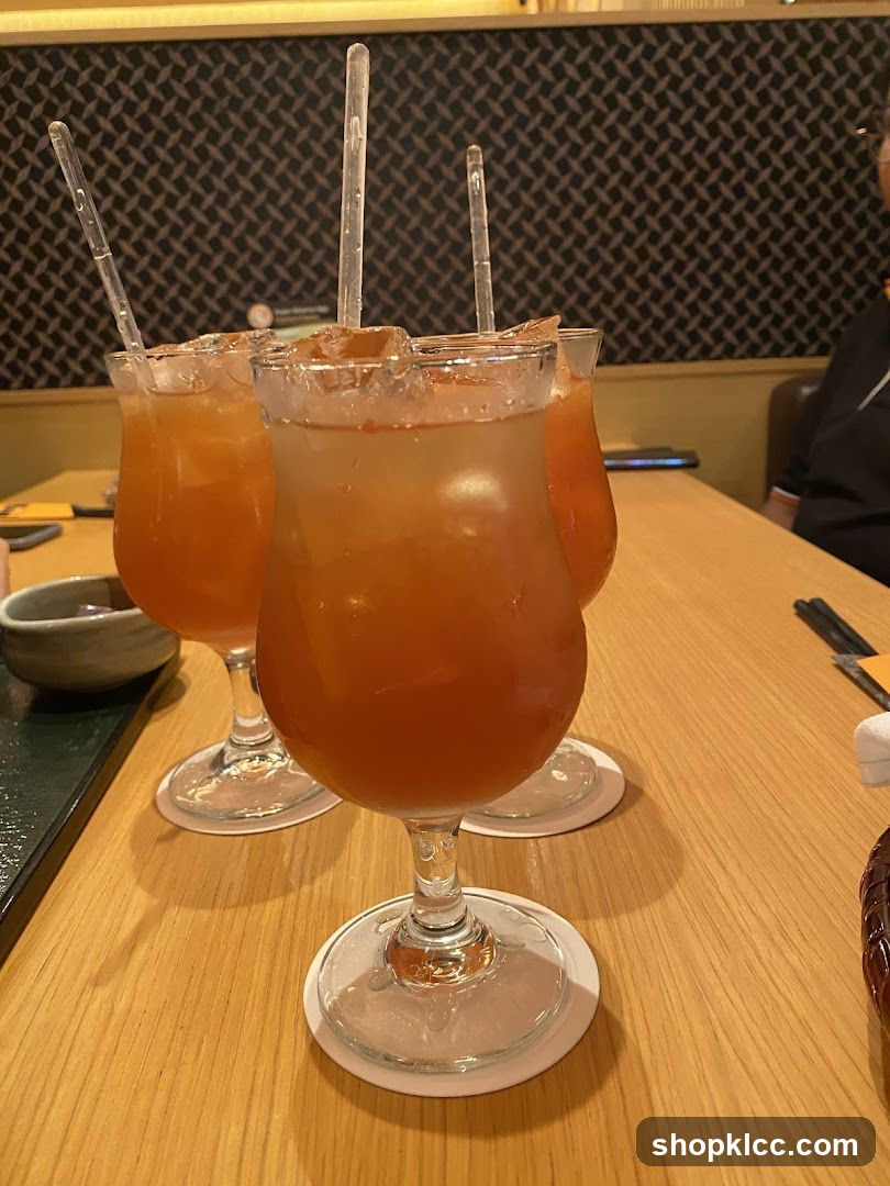 Three Orange Cocktails on a Table