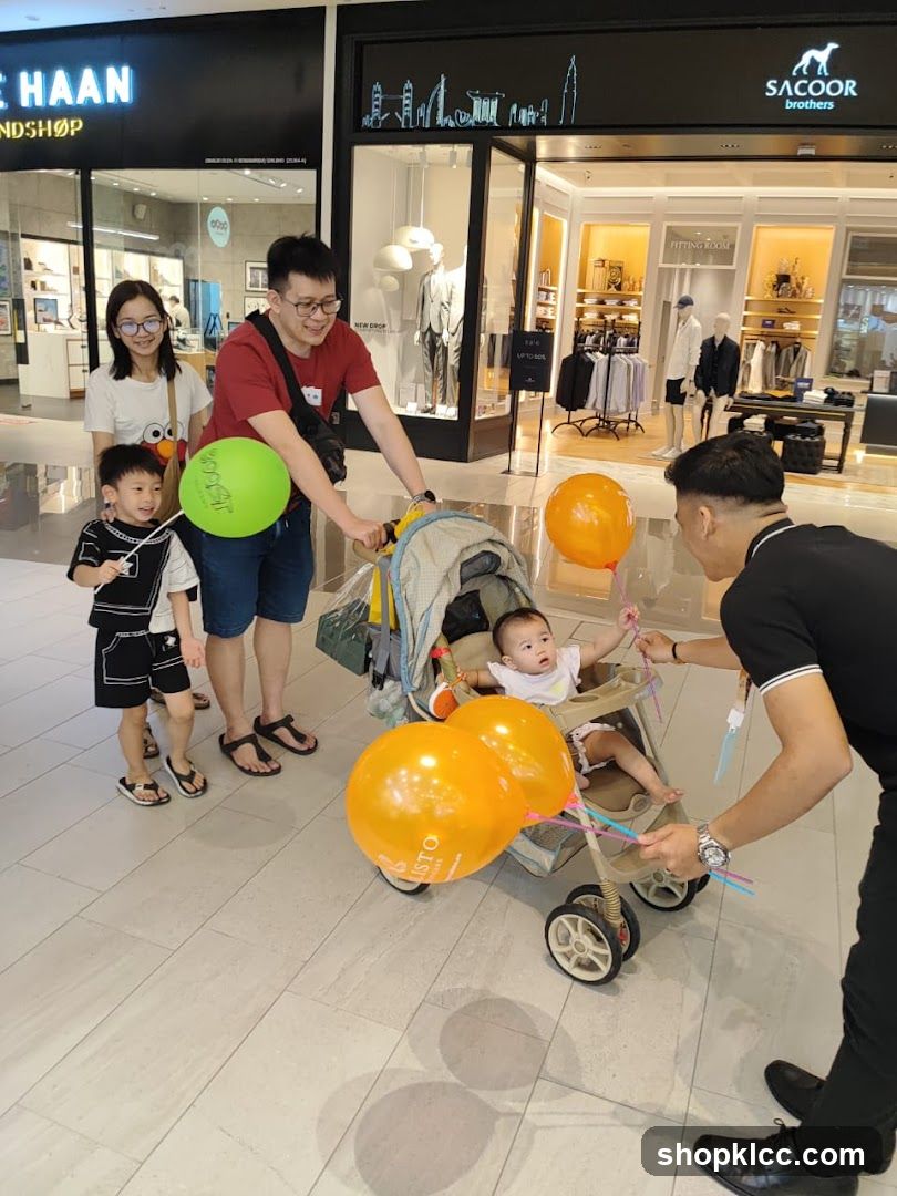 Family with baby in stroller at mall