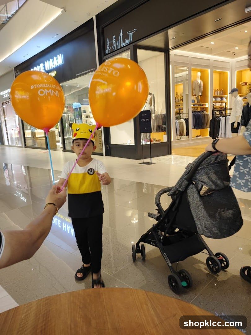 Child with balloons in mall