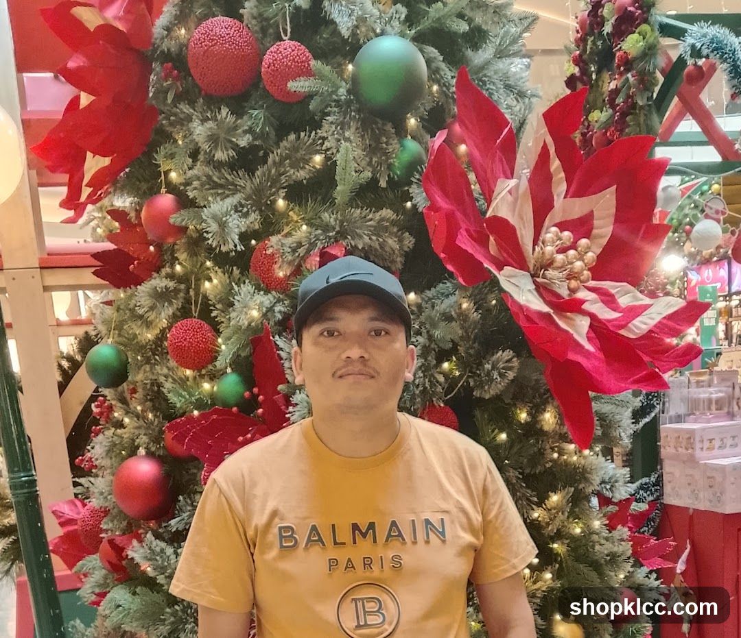 Man in front of Christmas Tree