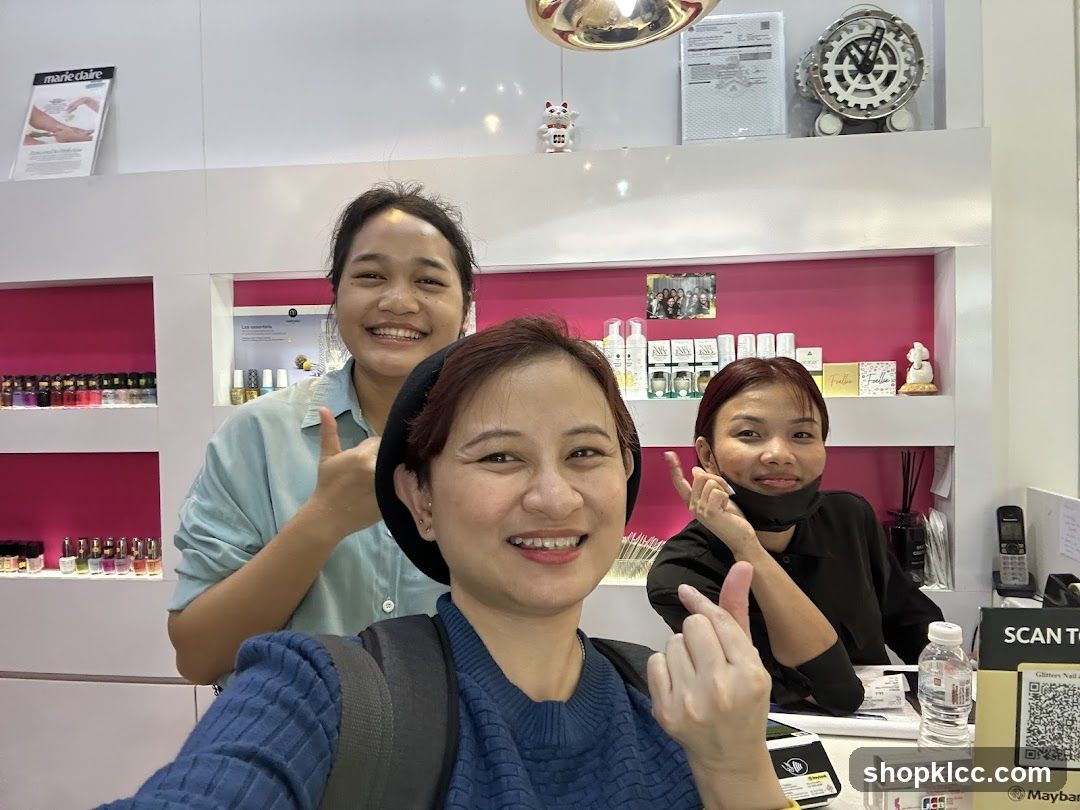 Three women smiling at the camera