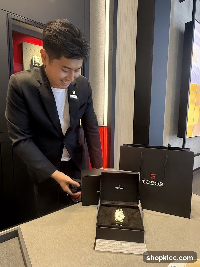 Salesperson presenting a Tudor watch