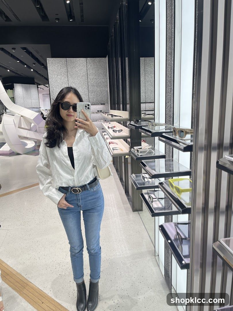 Woman taking a mirror selfie in a store