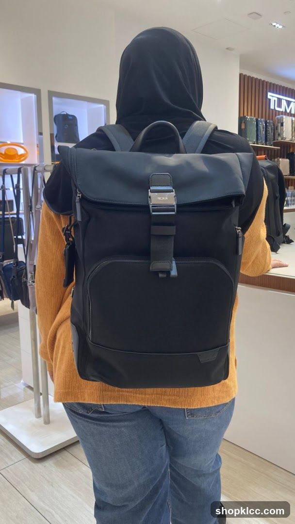 Person wearing a backpack in a store