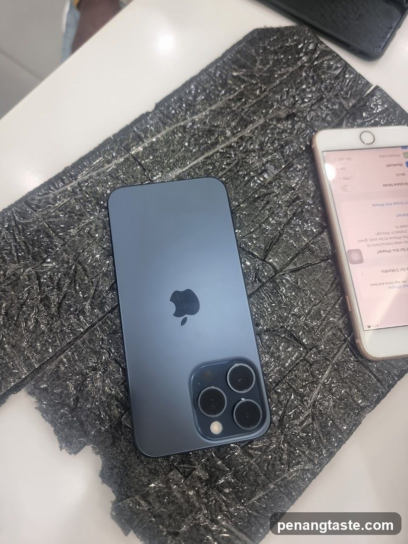 Two iPhones on a textured surface