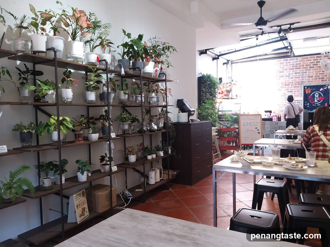 Interior of a cafe with plants and tables