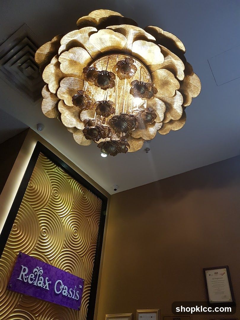 Interior of a spa with a decorative chandelier and signage