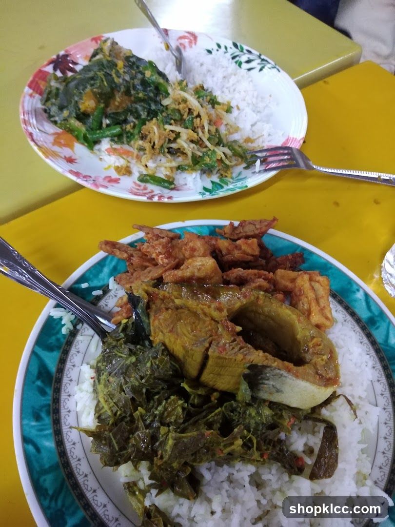 Two plates of rice with side dishes