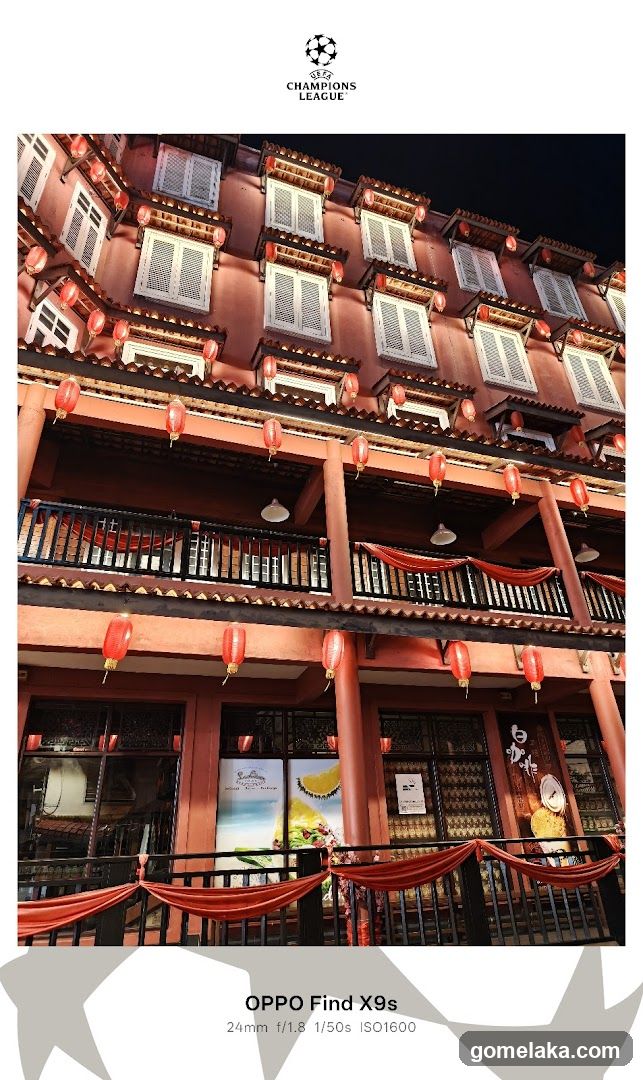 Traditional-style building facade with red lanterns and balconies