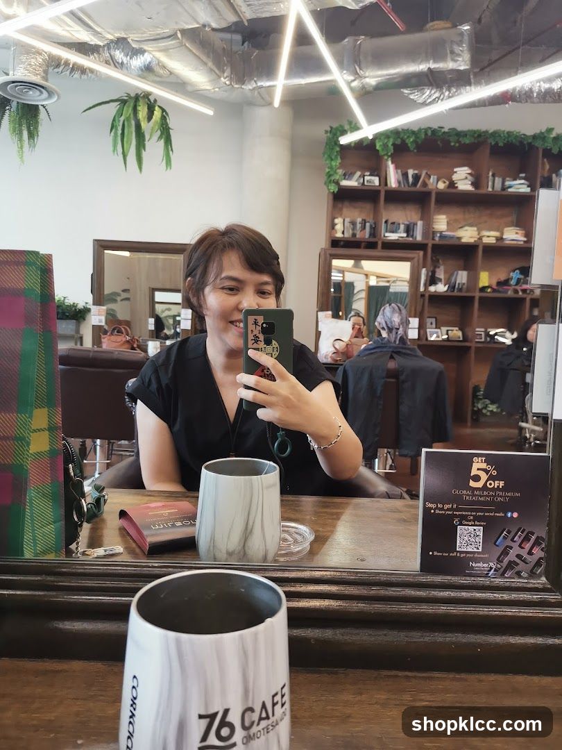 Woman taking a selfie in a salon