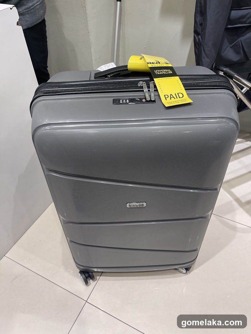 Gray Suitcase with Paid Tag