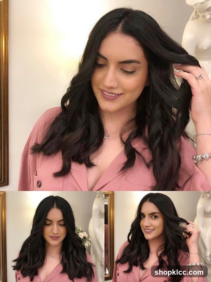 Woman with wavy dark hair in pink blazer