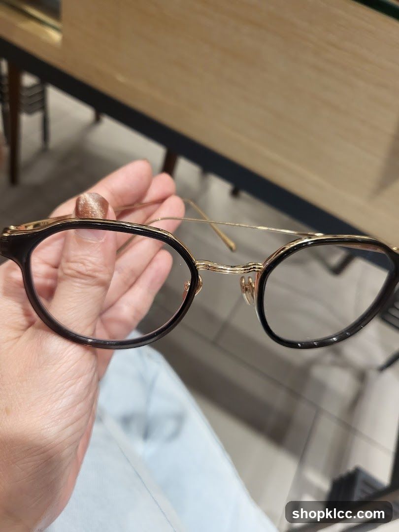 Eyeglasses held in hand