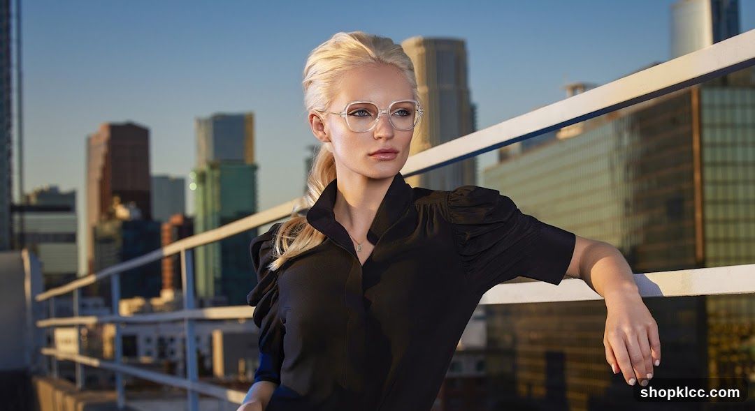 Blonde woman in black blouse on rooftop